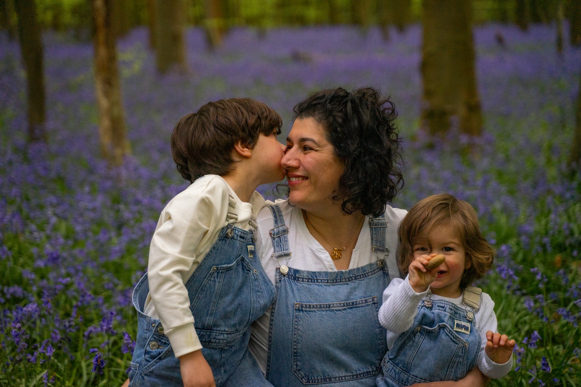 Children playing among the bluebells in a Buckinghamshire wood