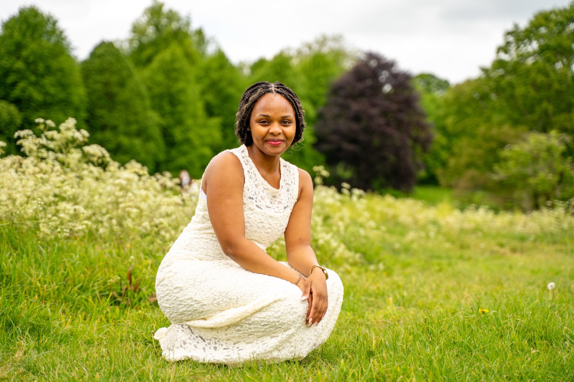 Portrait of a mother in a white dress in a Buckinghamshire meadow